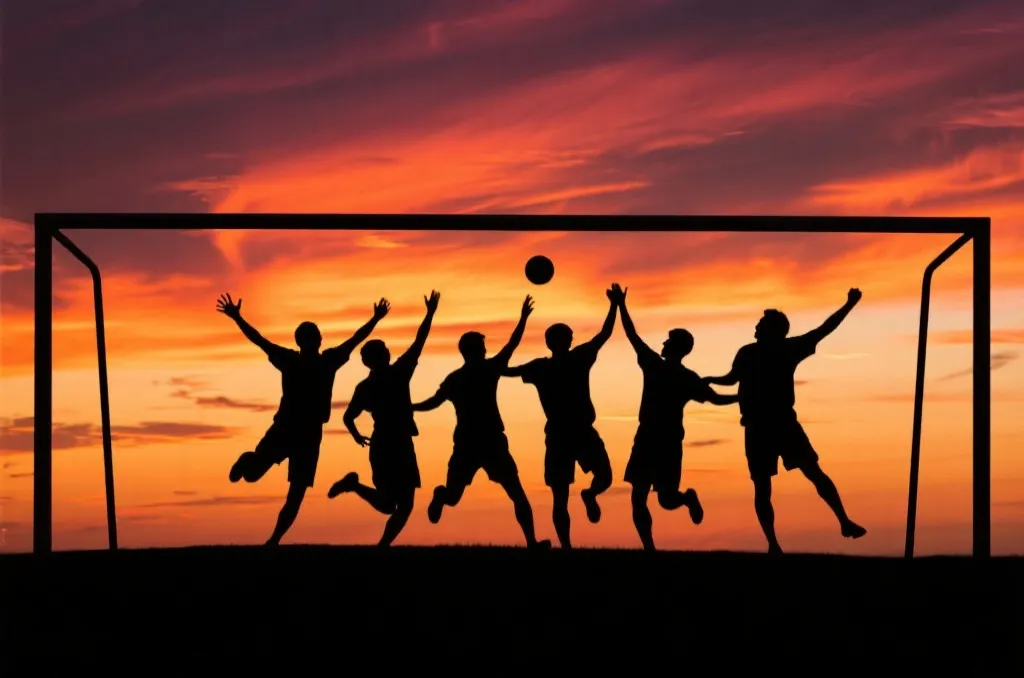 足球員在夕陽下慶祝勝利的剪影畫面